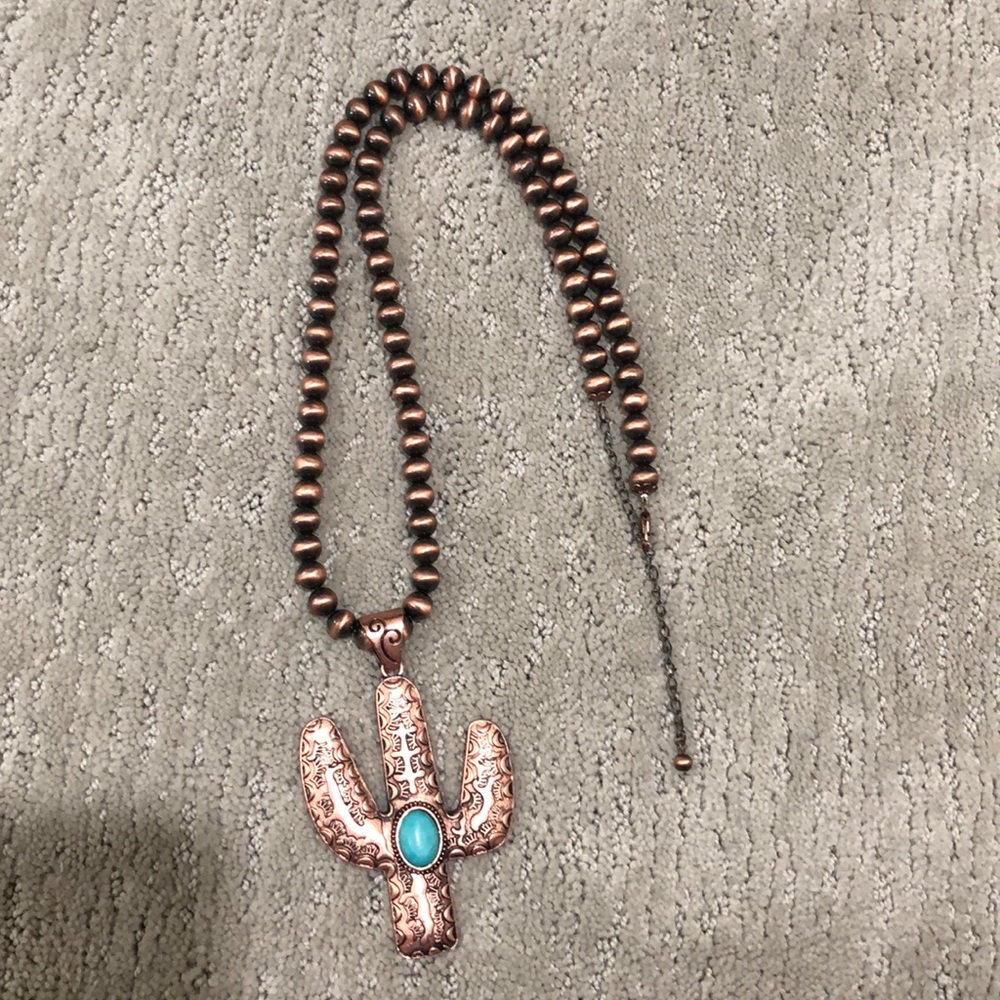 Rose gold cactus necklace.